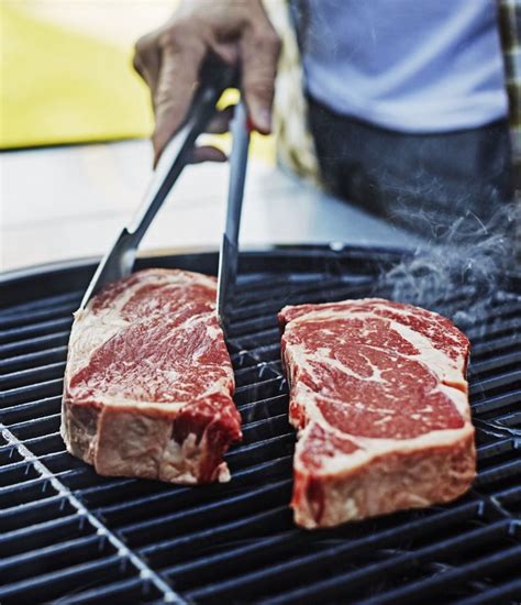 grilling ribeye steak on gas grill